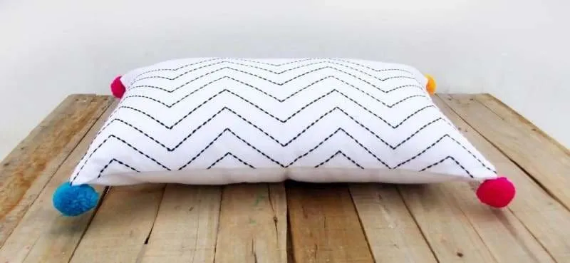 Cotton white pillow with aztec zig zag embroidery